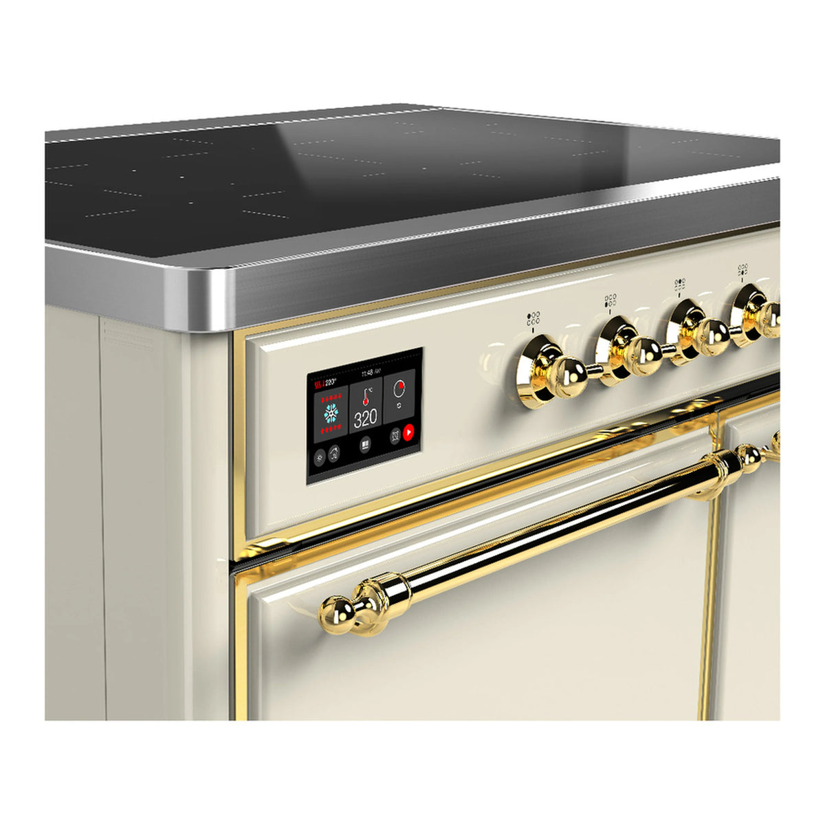 Antique white induction range close-up: black display and brass control knobs