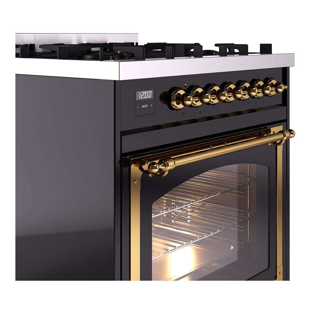Black range control panel with brass knobs and oven door window