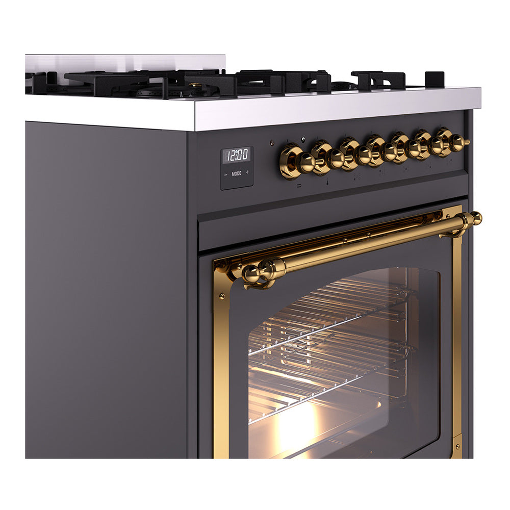 Matte graphite range control panel with brass knobs and lit oven window