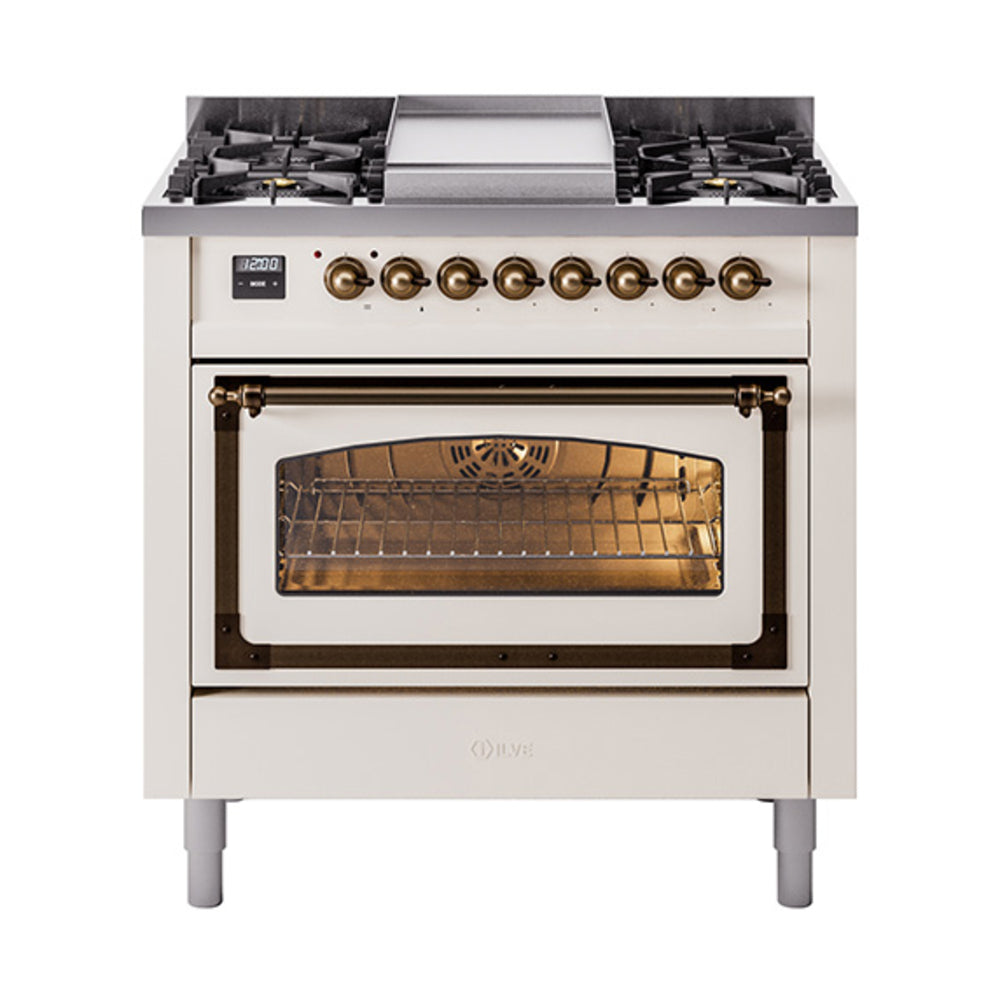 Antique white dual-fuel gas range with bronze-trimmed oven door and visible oven interior