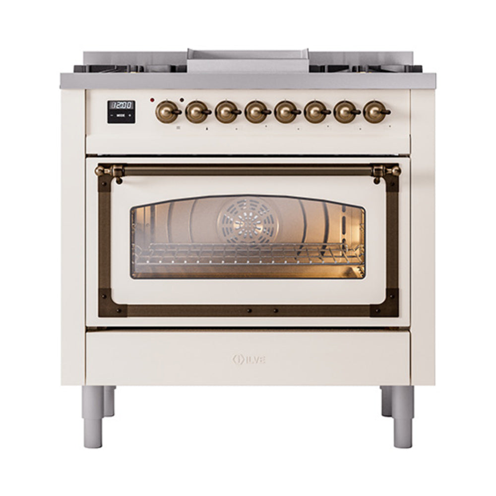 Antique white dual-fuel gas range with glass oven door and bronze-finished control knobs