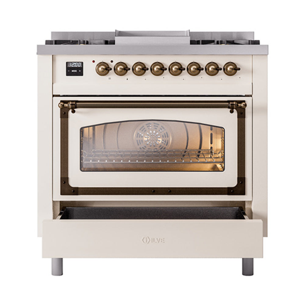 Antique white gas range with bronze knobs, glass oven door window, warming drawer open