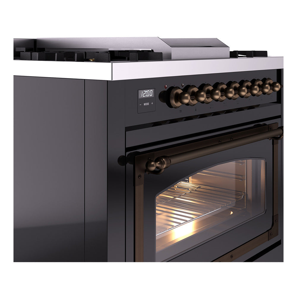 Glossy black dual-fuel range with bronze-finished control panel and triple-glass oven door