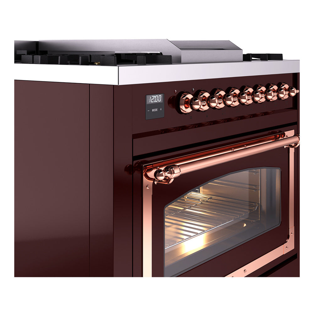 Burgundy dual-fuel range with copper control knobs and oven window, angled view