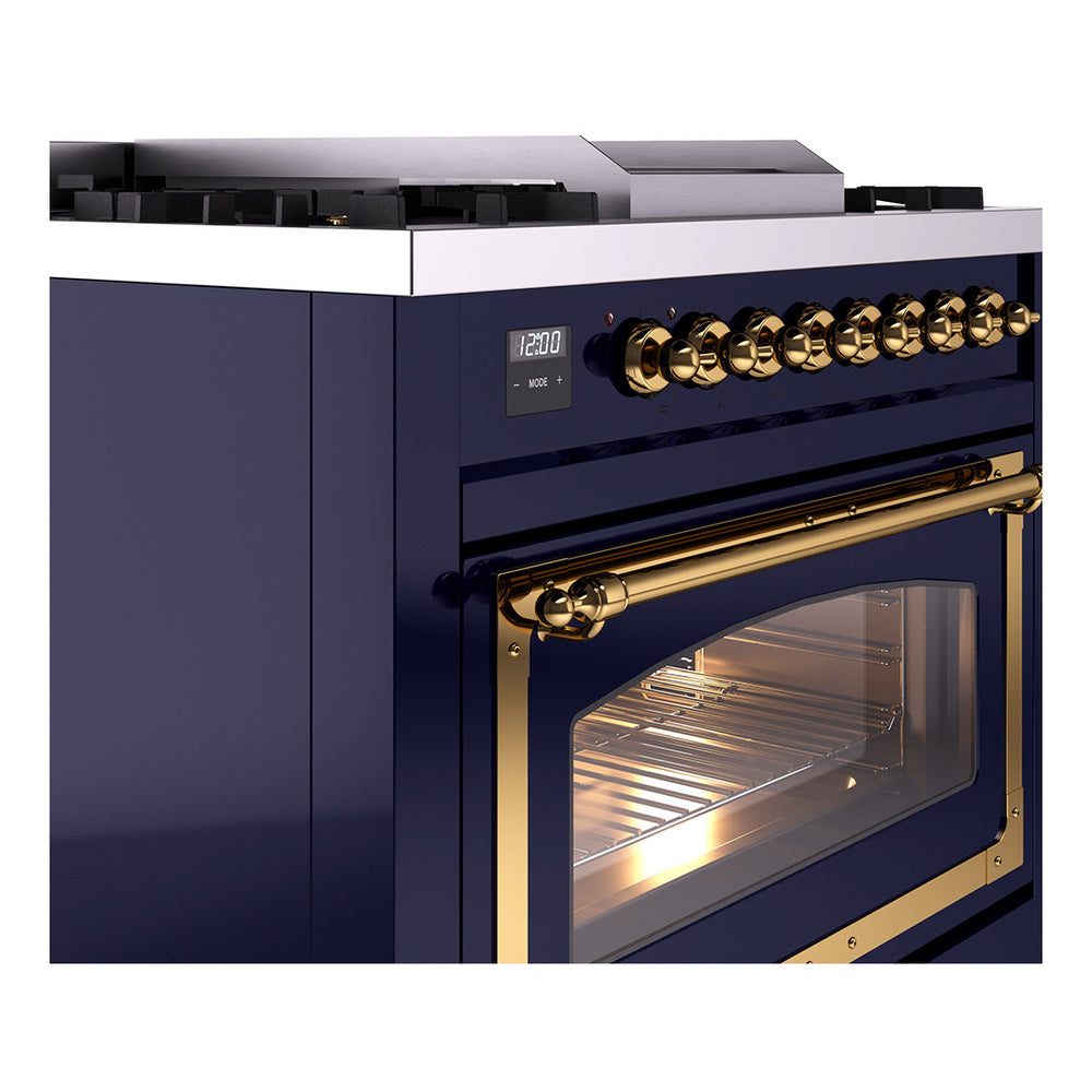 Midnight blue range control panel with gold knobs and brass-trim oven window