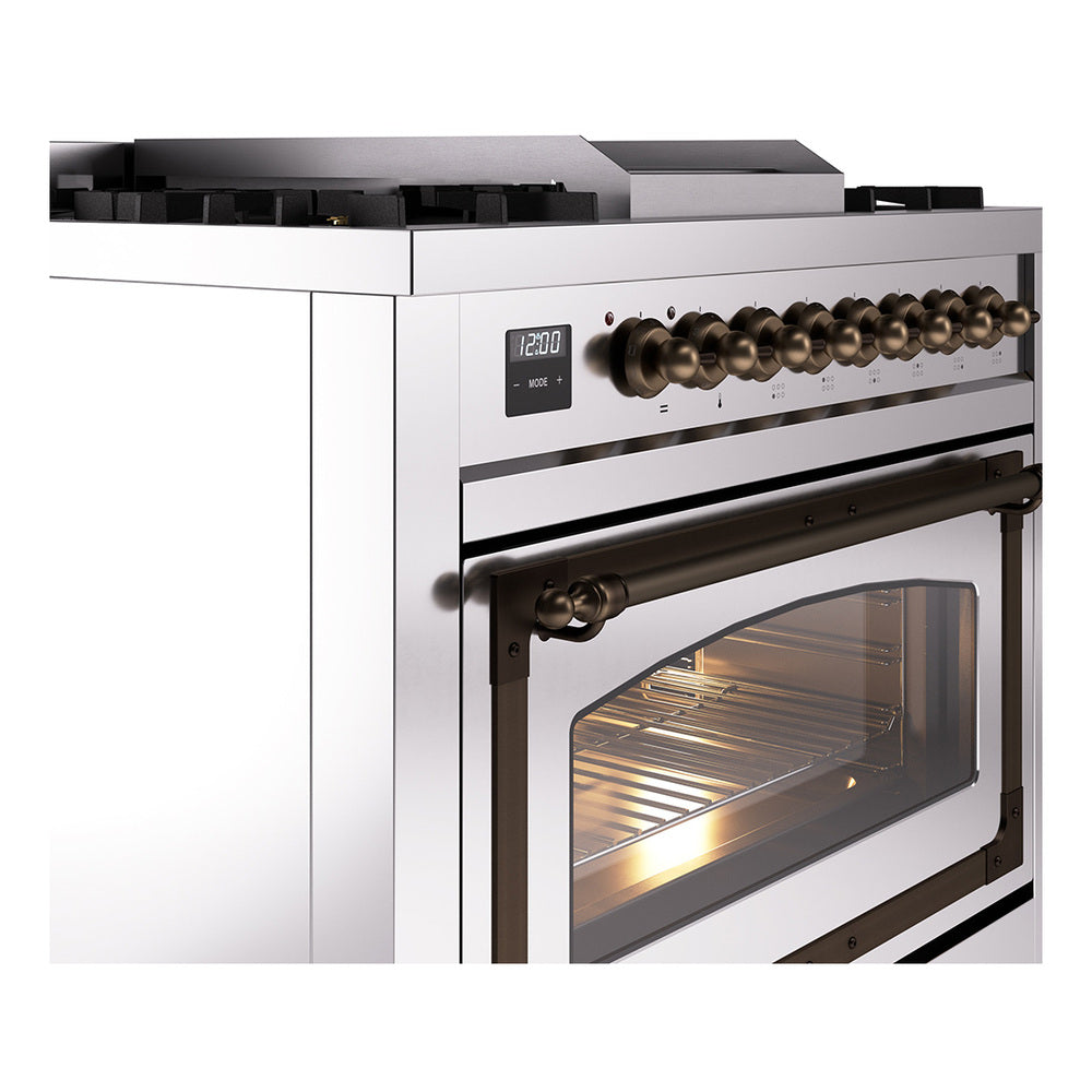 Stainless steel dual fuel range showing bronze control knobs and oven door window