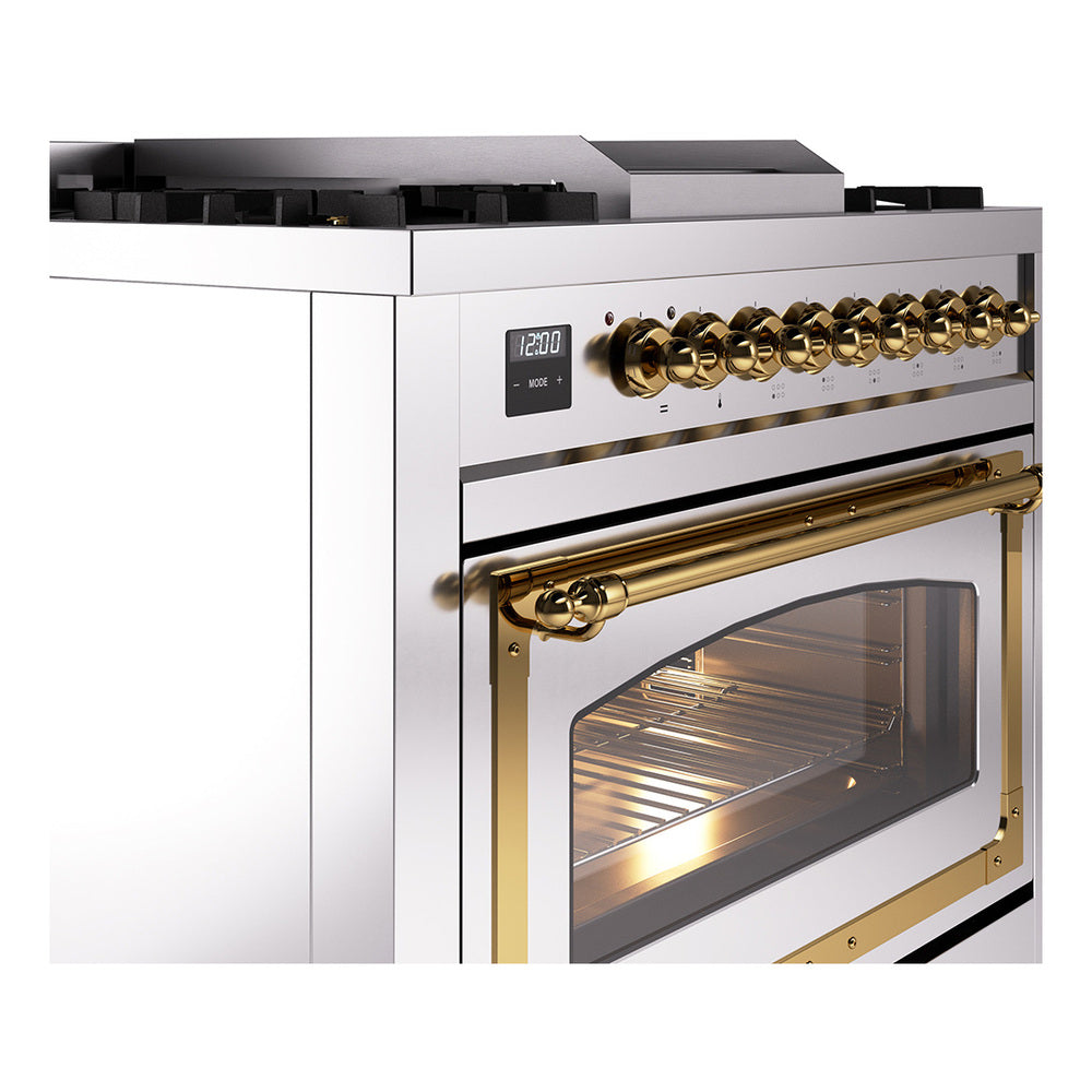 Stainless steel range with brass control knobs, brass oven handle, and glass oven window