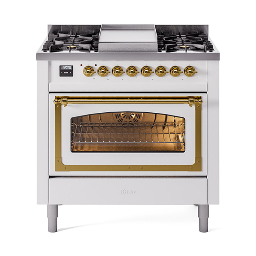 White dual-fuel gas range with brass trim, oven window, and six black burner grates