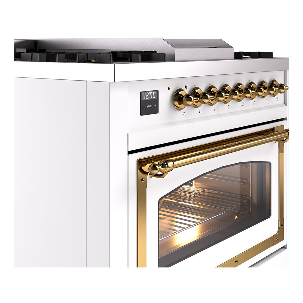 White dual-fuel gas range with brass control knobs and gold-trim oven door glass