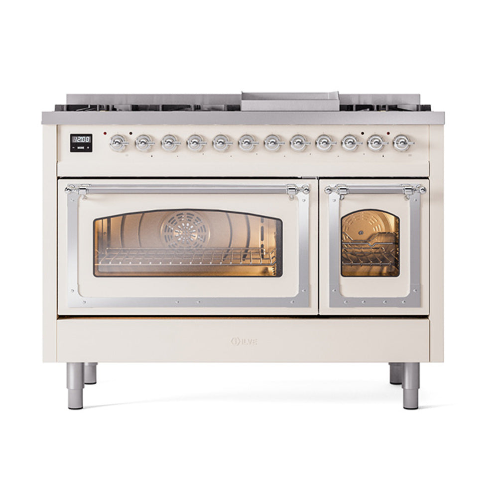 Antique white dual-fuel range with lit oven interiors, chrome handles, and control knobs