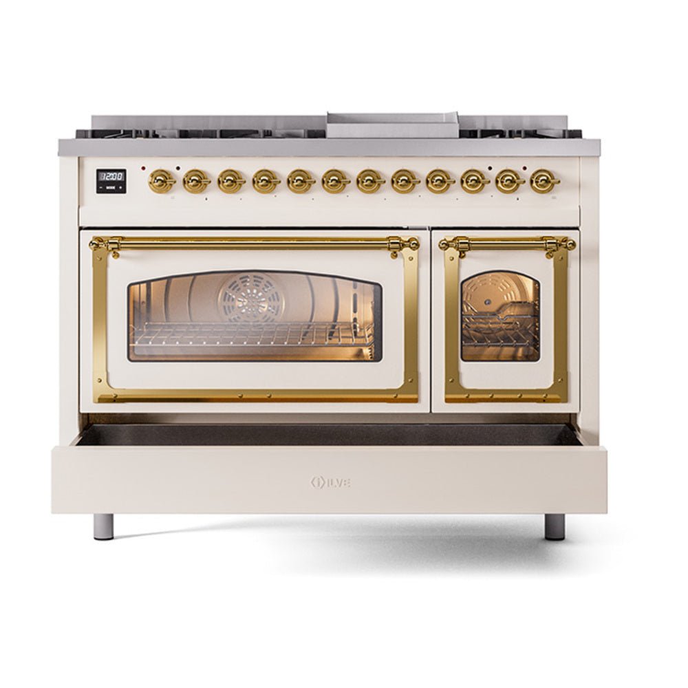 Freestanding dual fuel range in antique white with brass handles and two oven windows.