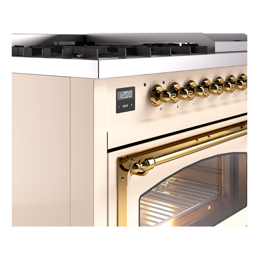 Freestanding dual fuel range control panel with brass knobs and brass oven handle.
