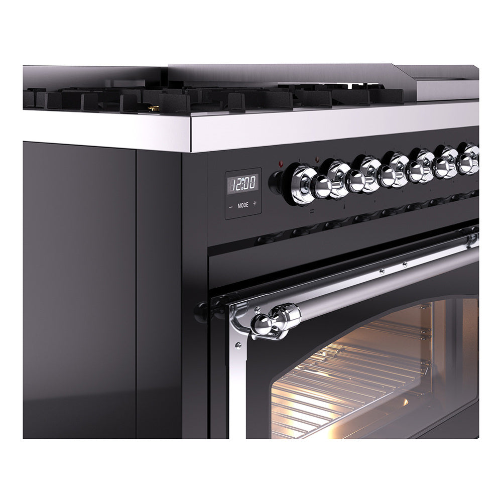 Chrome control knobs and oven handle on a glossy black dual fuel freestanding range