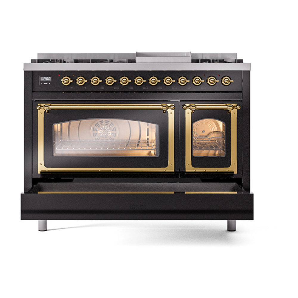 Glossy black freestanding range with brass-trimmed double oven doors open, interior lit