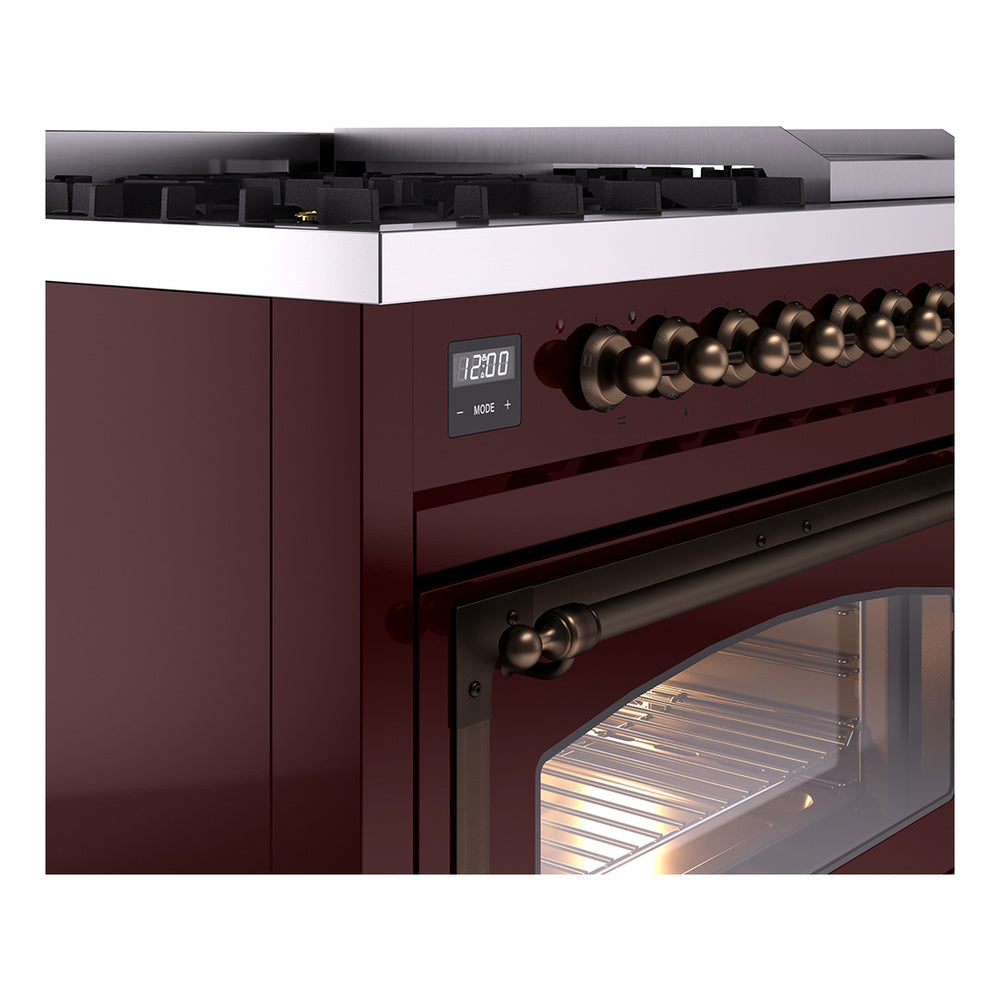 Freestanding dual-fuel range close-up of burgundy control panel with knob row and display
