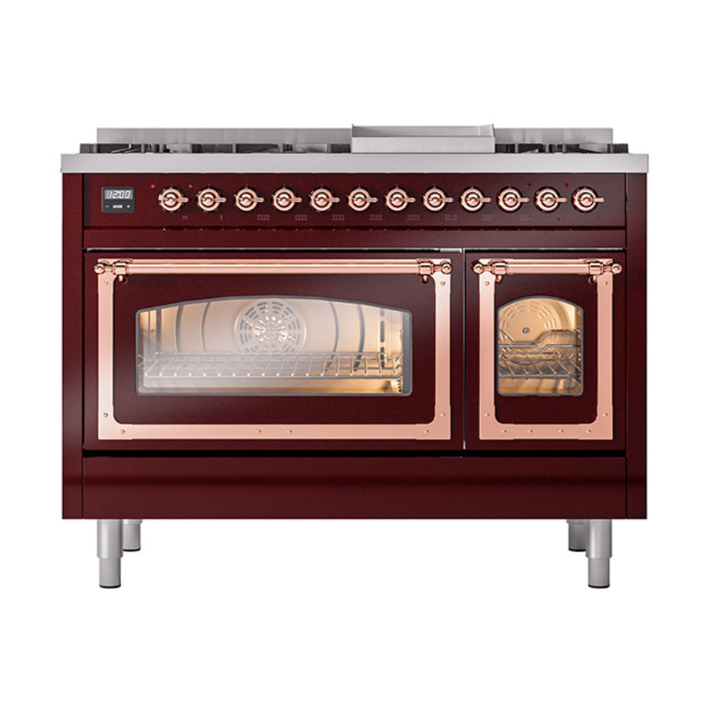 Burgundy dual fuel range with copper-trimmed doors, lit oven windows, and control knobs