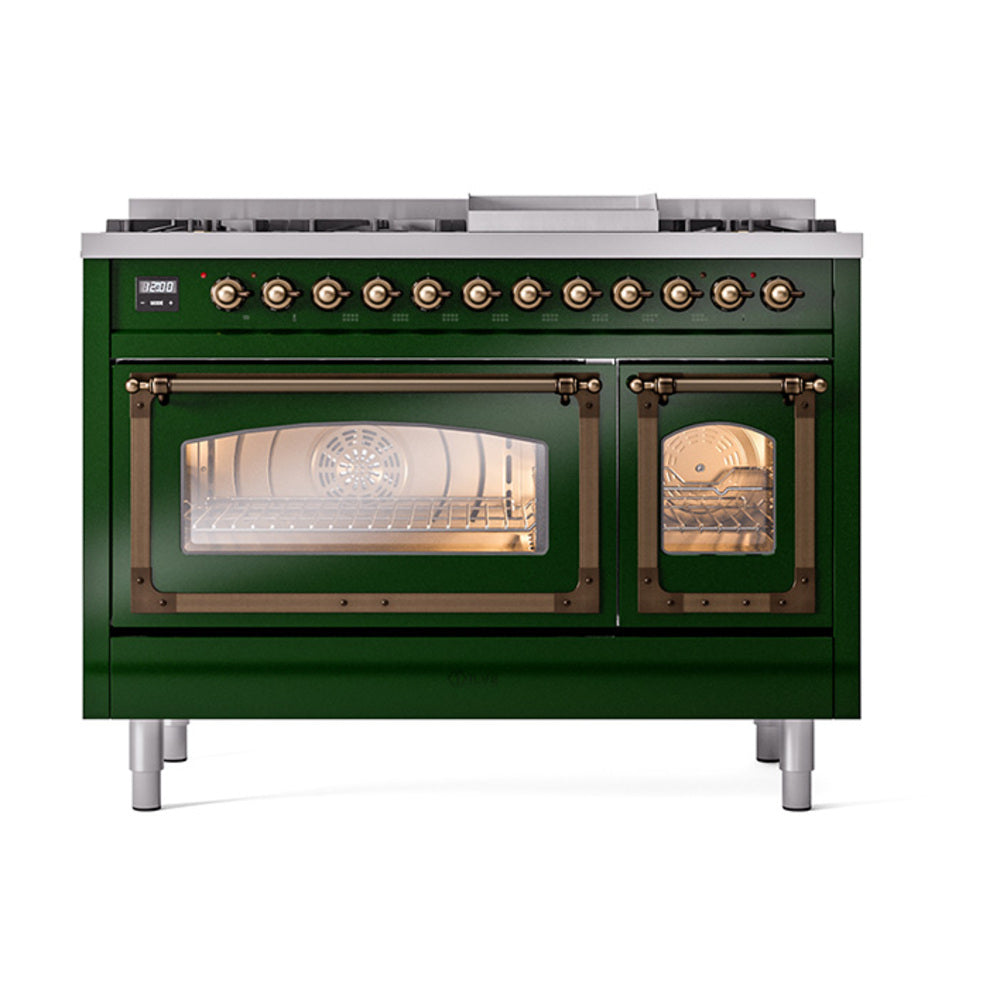 Emerald green freestanding range with bronze control knobs and glowing oven lights