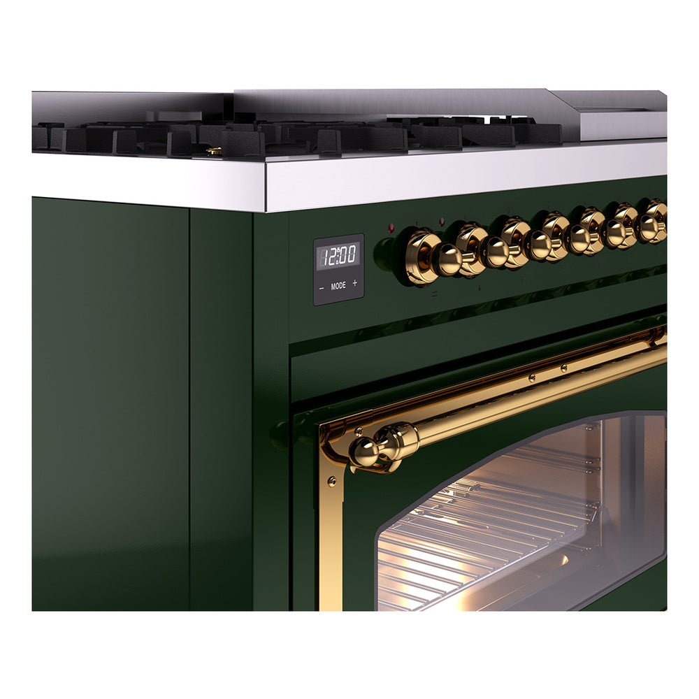 Emerald green range control panel with brass knobs and illuminated oven handle and door