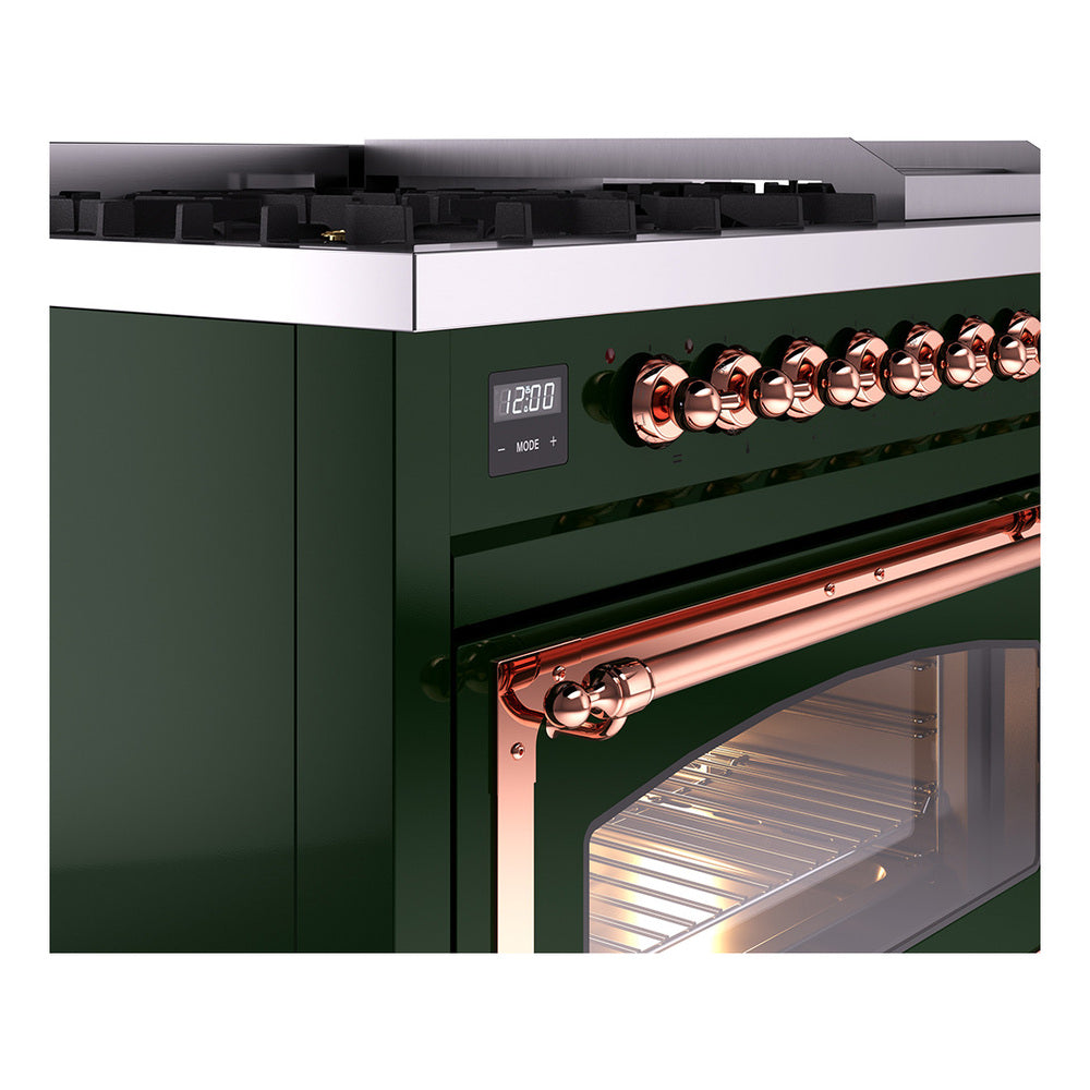 Close-up of emerald green dual fuel range with copper control knobs and oven handle.