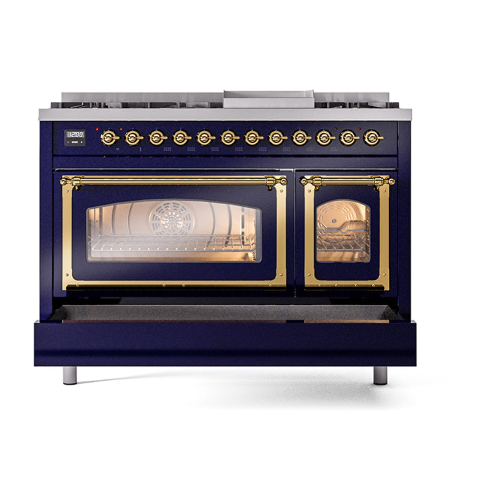 Midnight blue freestanding gas range with both oven windows lit and brass-trimmed doors