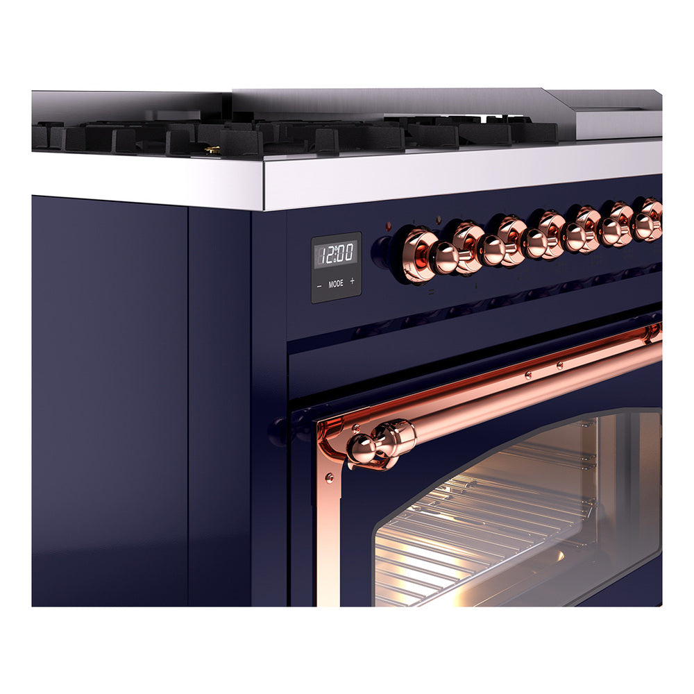 Midnight blue dual fuel range: close-up of copper control knobs and illuminated display.
