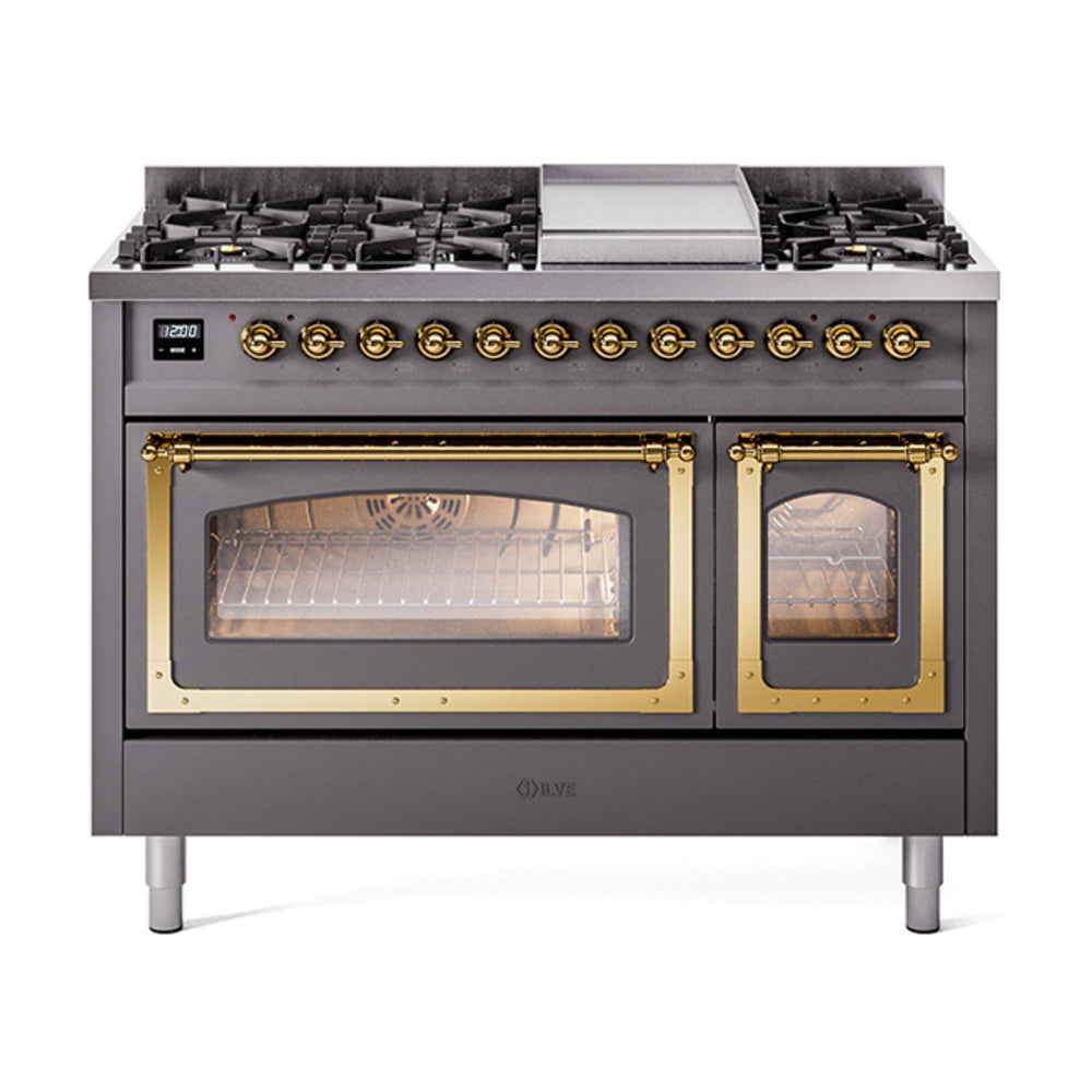 Matte graphite dual fuel range with burners and open ovens, brass trim and lit interior