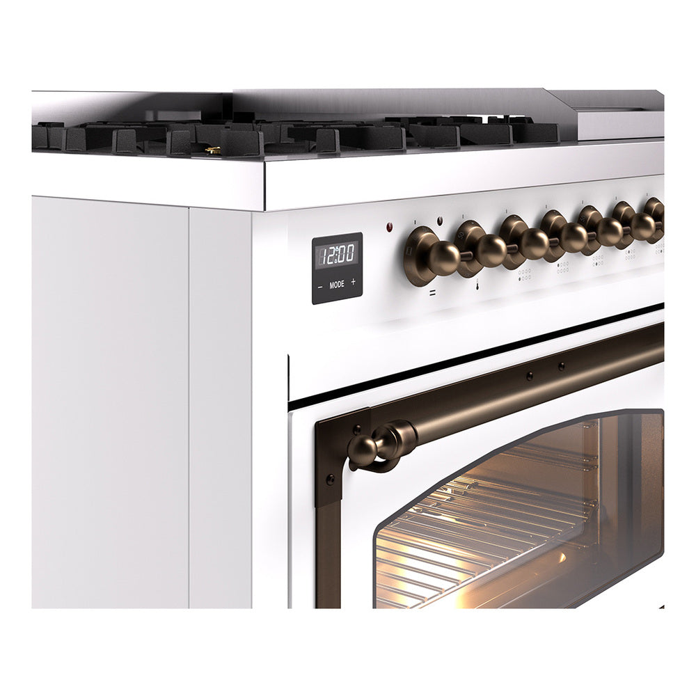 Freestanding range control panel with bronze knobs and lit oven window
