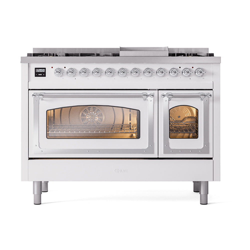 Freestanding dual fuel range with two oven windows lit; chrome control knobs