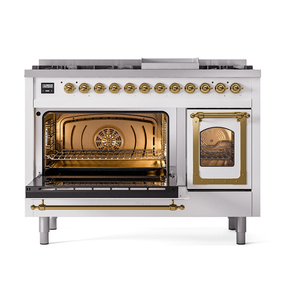 Dual fuel range with left oven open and right baking compartment with brass trim