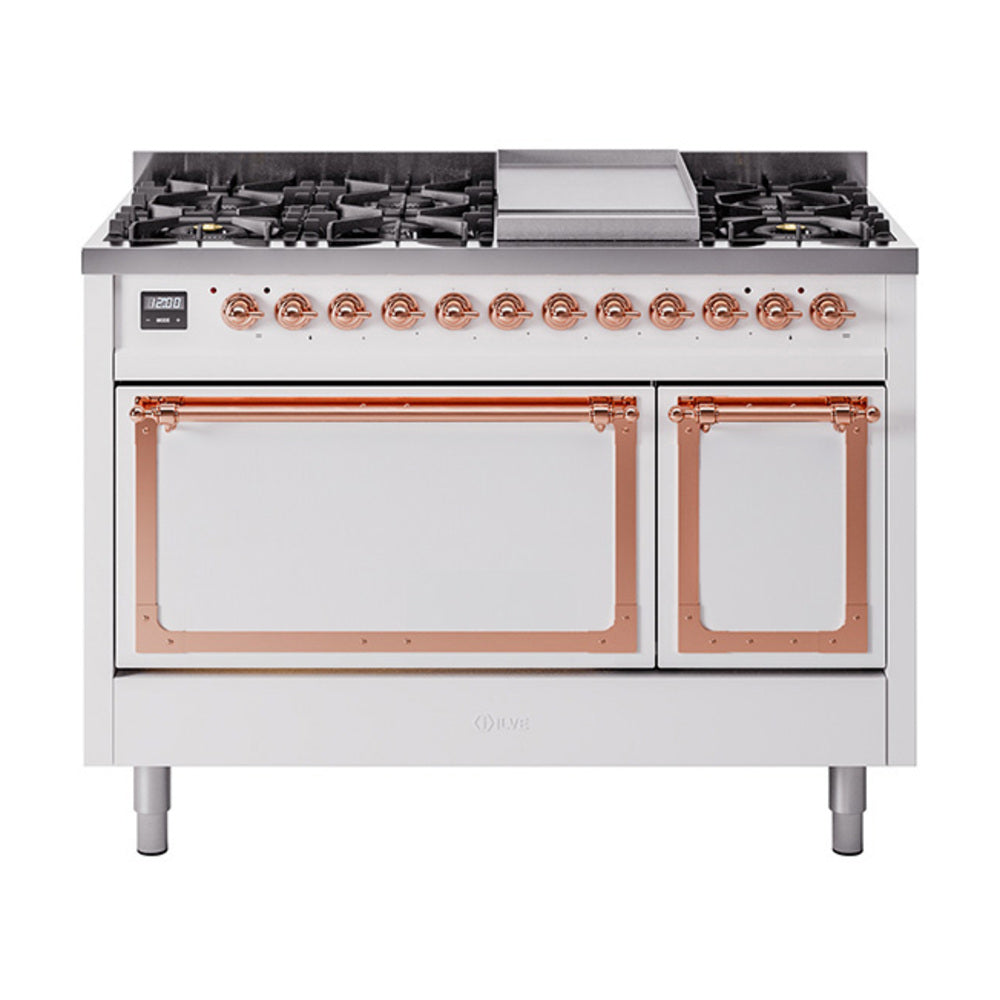 White freestanding dual fuel range with copper control knobs and solid oven doors