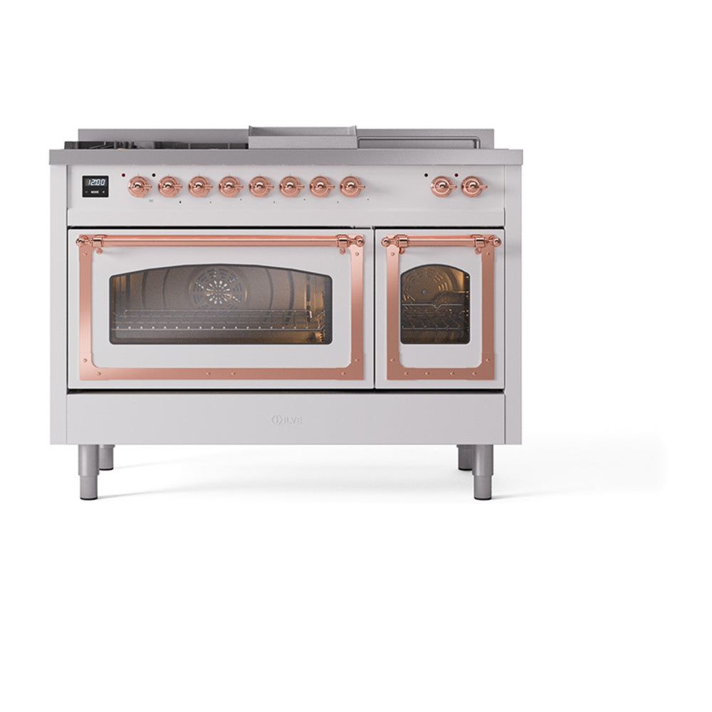 Front view of dual-fuel range with copper control knobs and two oven doors with glass panels