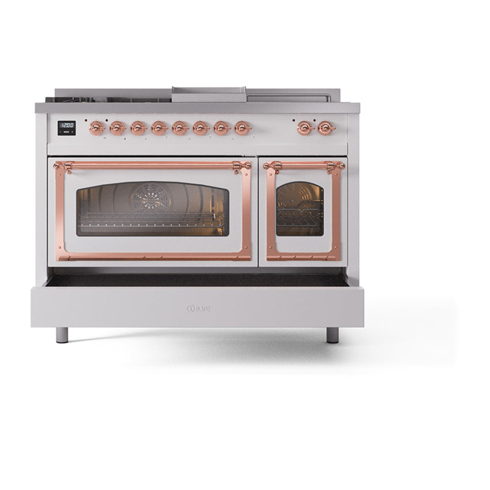 Dual-fuel range front view with copper-trimmed oven door handles and matching control knobs