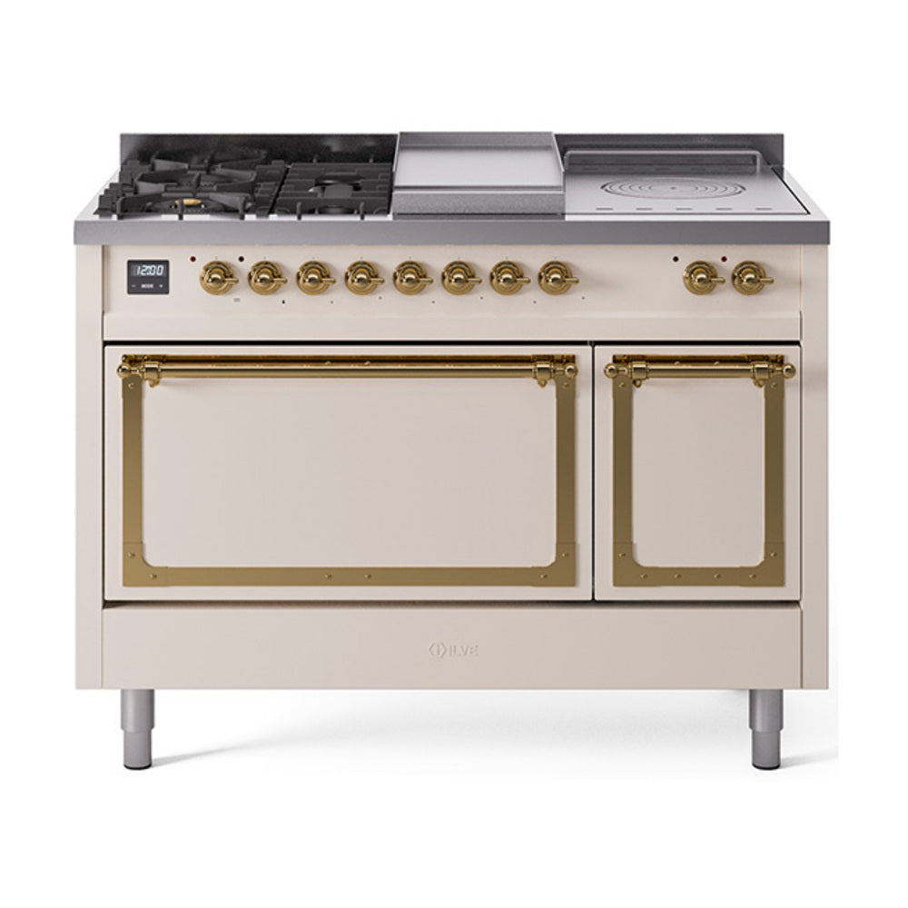 Antique white gas range with brass-trimmed knobs, dual ovens, and griddle on top