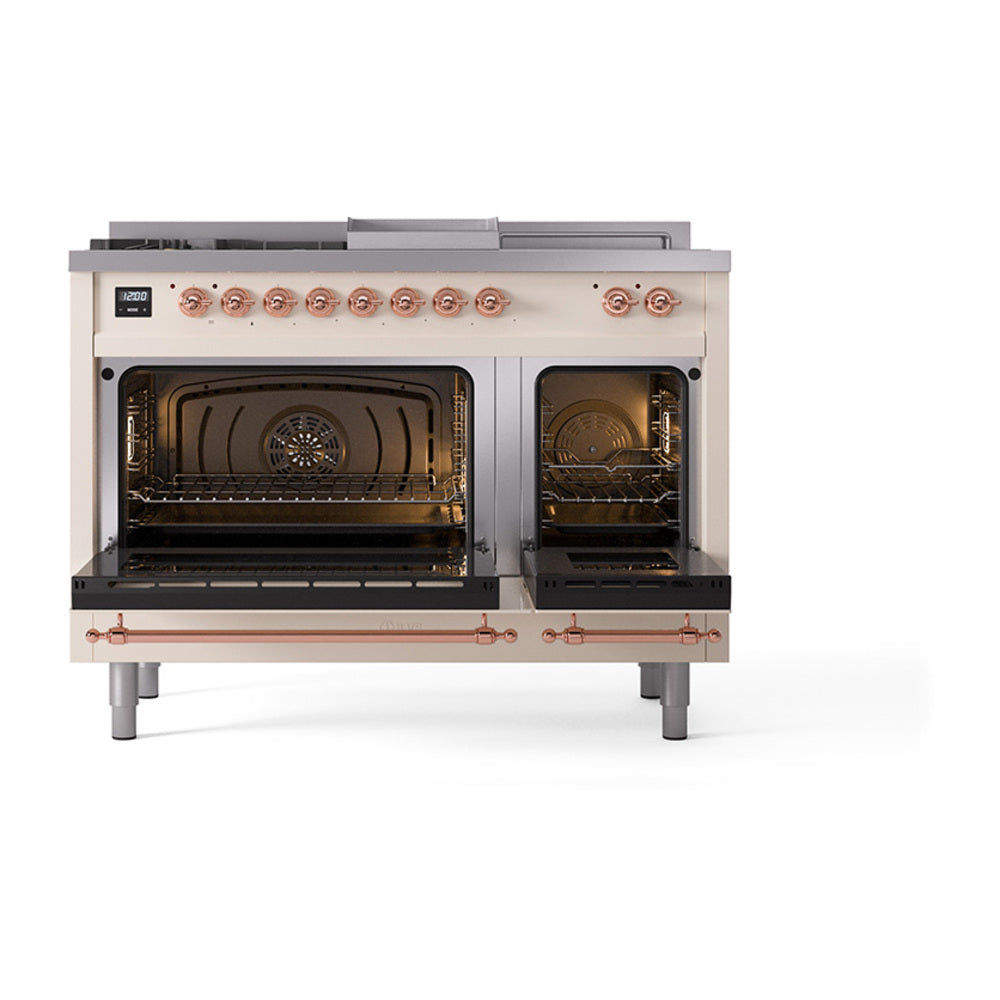 Antique white dual fuel range with copper-trimmed open ovens and control knobs
