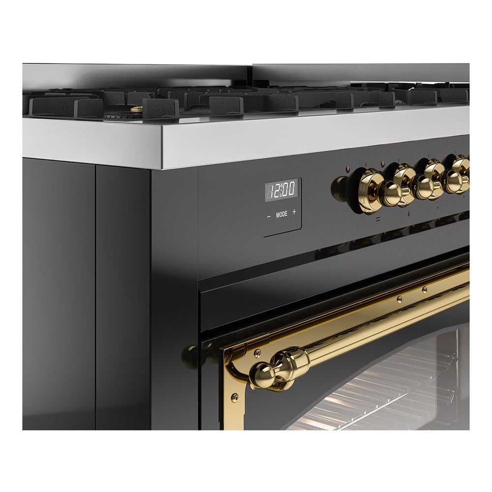 Close-up of glossy black range controls and brass oven handle with open door