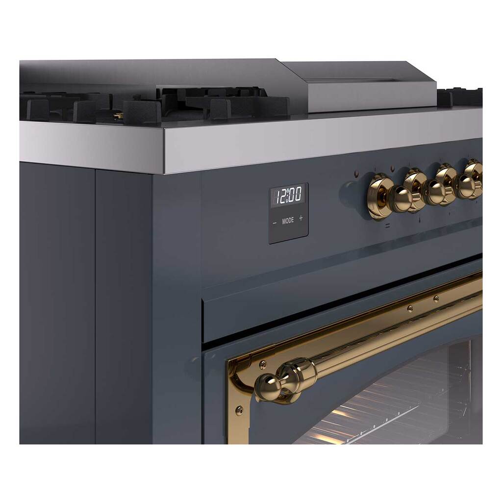 Close-up of blue grey range control panel with brass knobs and digital display