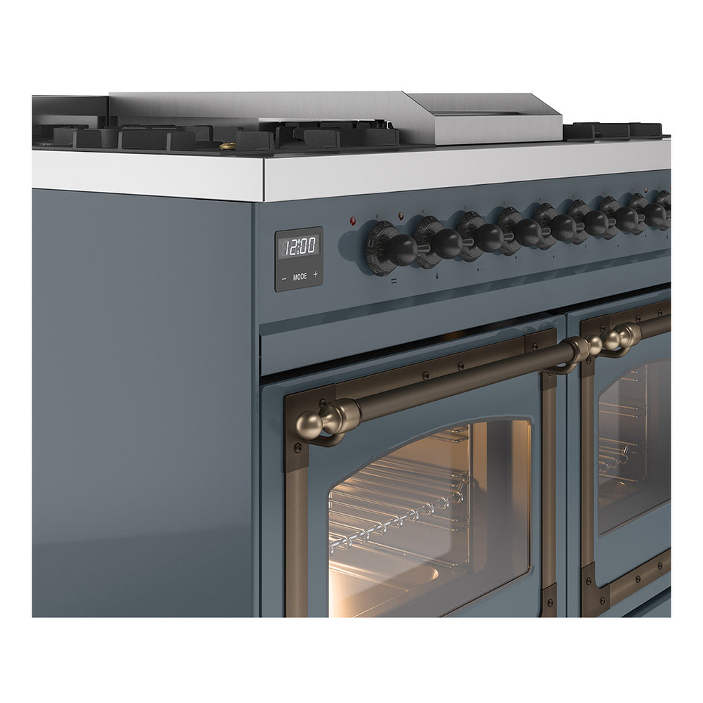 Close-up of blue-grey range control panel, oven door, and bronze handle trim