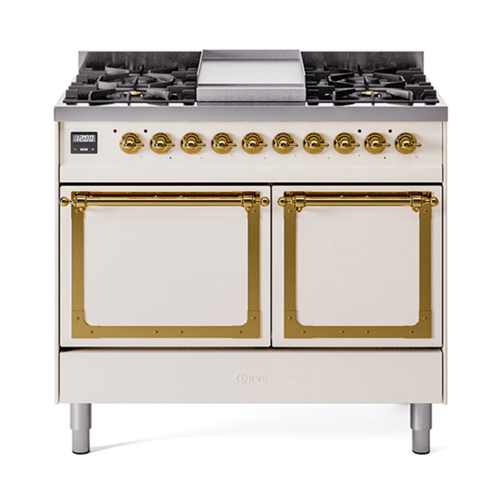 Antique white dual fuel range with brass trim, two glass oven doors, black burner grates