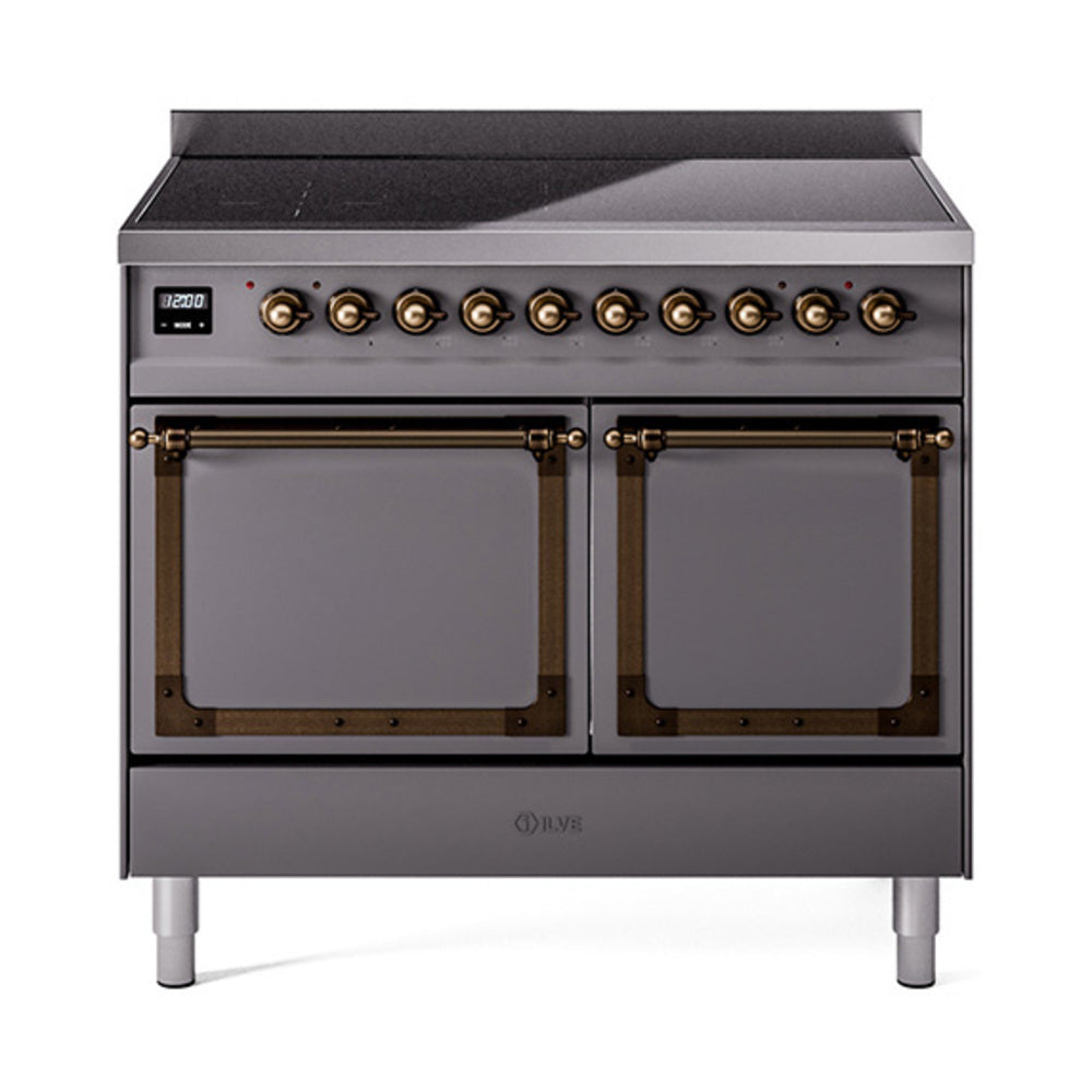 Matte graphite induction range with bronze knobs and two glass-front oven doors