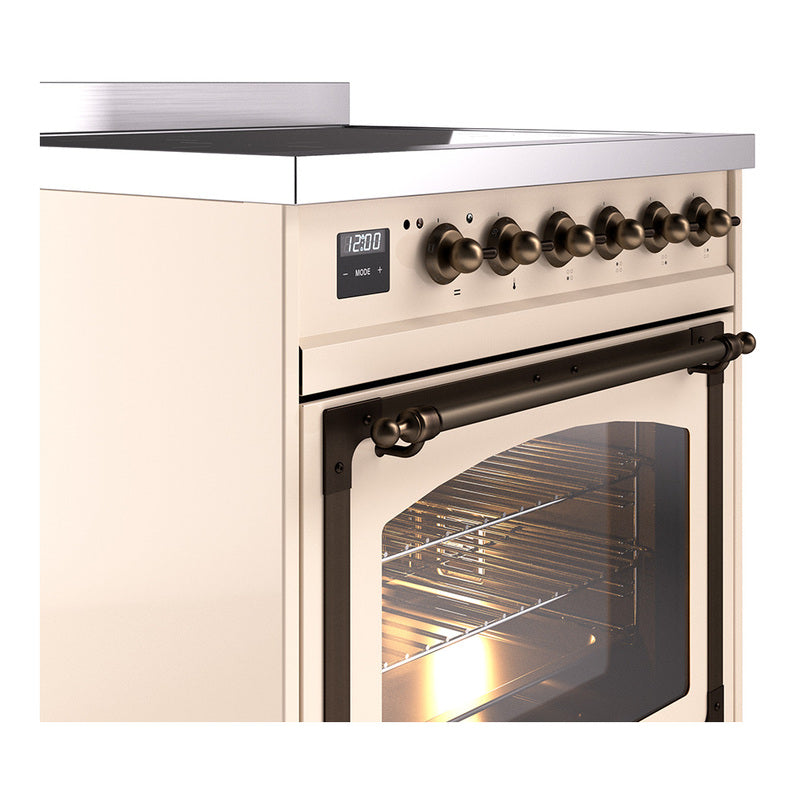 ILVE induction range control panel with bronze knobs and lit oven door opening