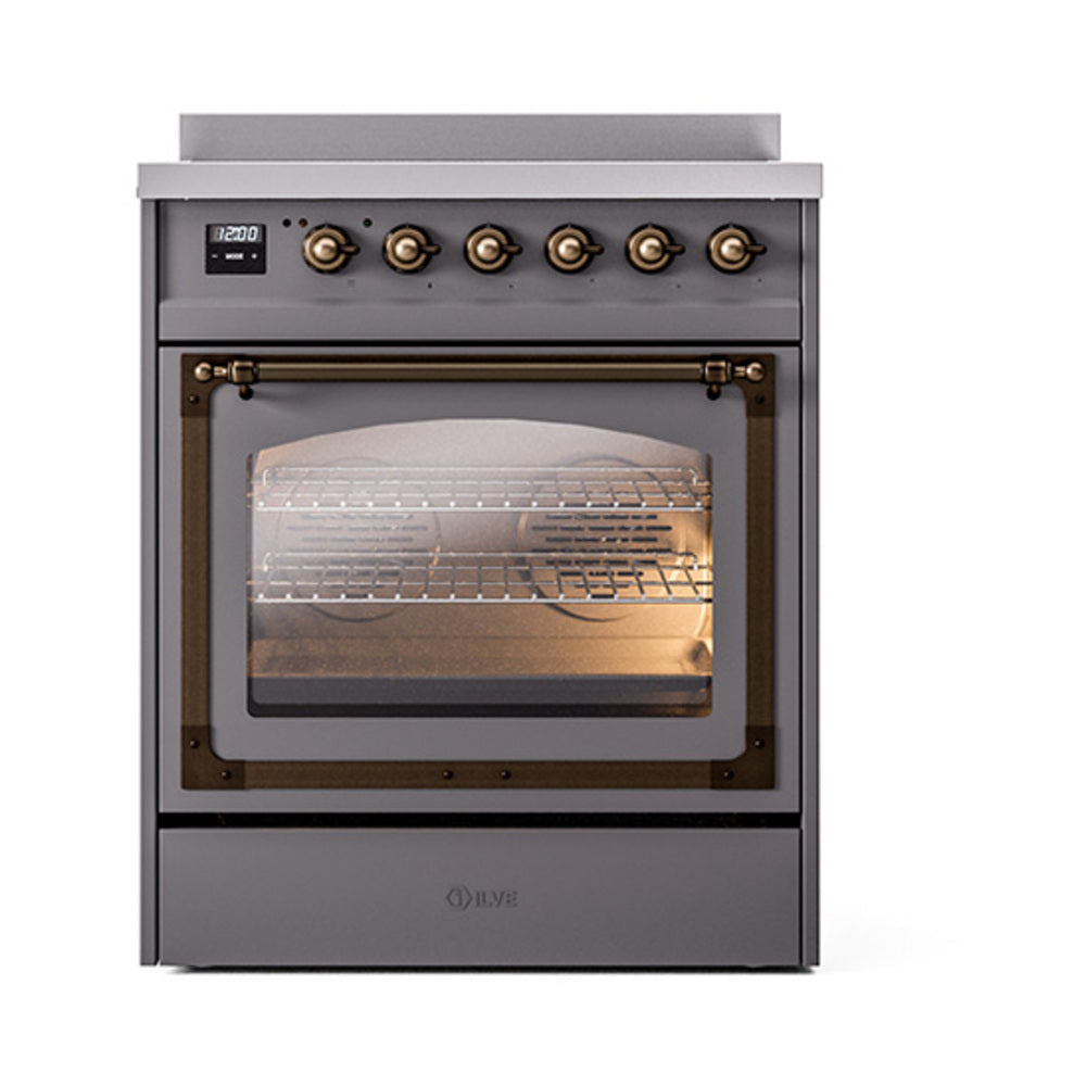 Matte graphite induction range with bronze-trim knobs and lit oven interior