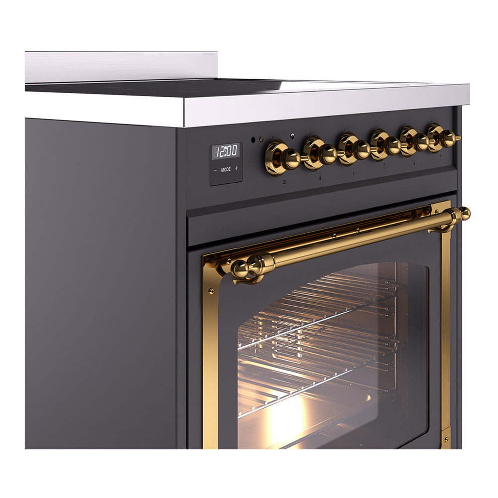 Side view of matte graphite induction range with gold control knobs and brass oven handle