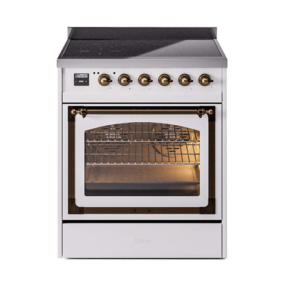 White induction range with bronze knob control panel and lit oven cavity behind glass