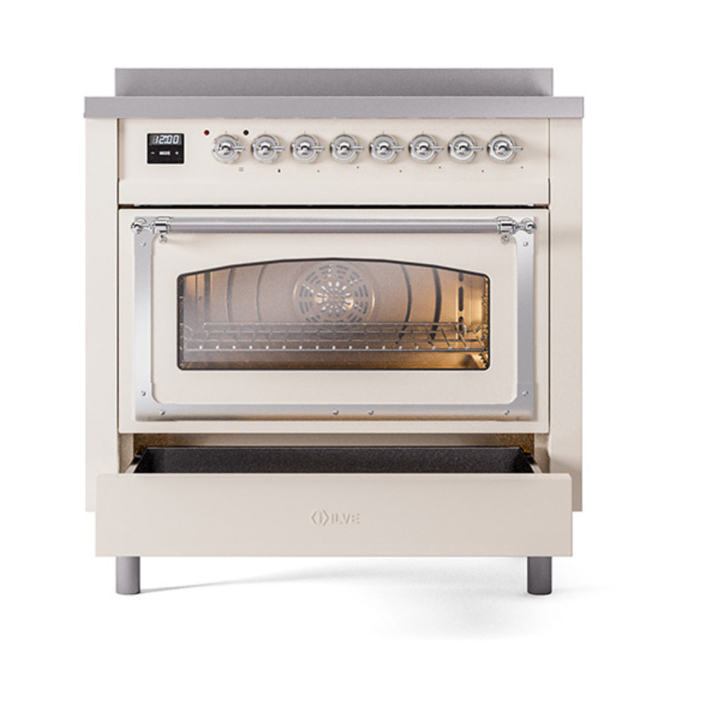 Antique white oven with closed glass door, chrome control knobs, and warm interior glow