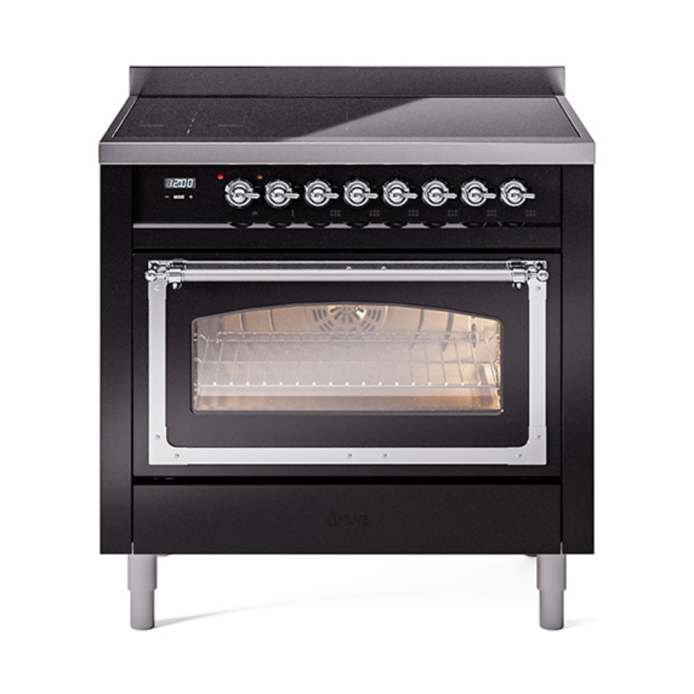 Black oven with chrome handle and lit interior behind triple glass door