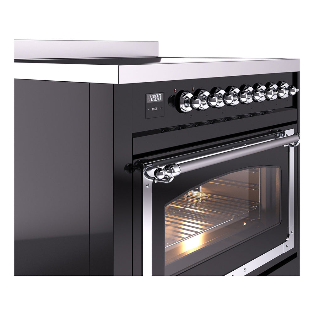 Black induction range control knobs and oven door with chrome frame and glass window