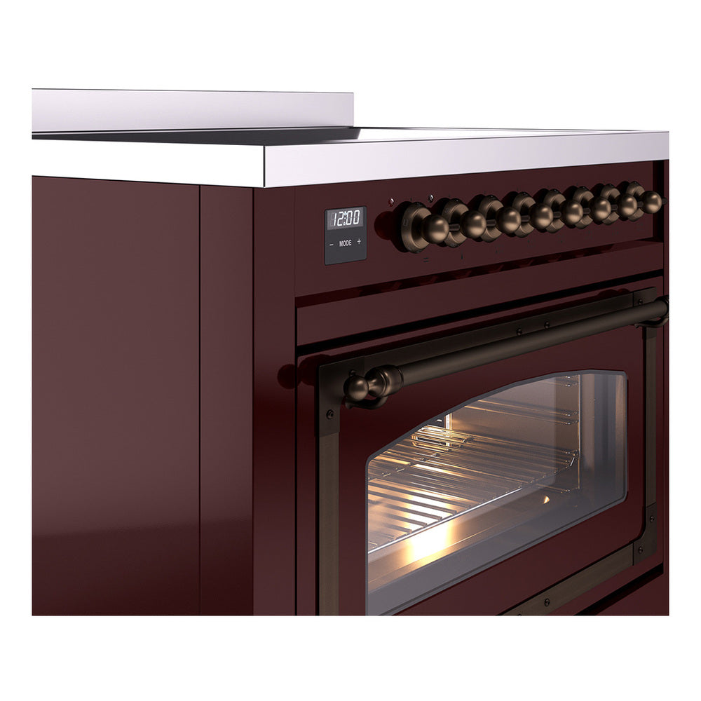 Burgundy induction range oven control knobs with bronze trim and open oven door