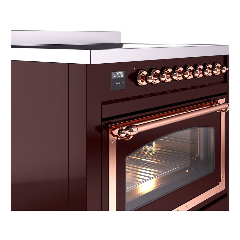 Burgundy induction range with copper-trimmed oven door and control knob row