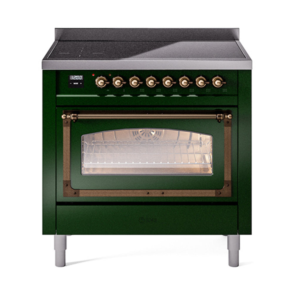 Emerald green induction range with bronze knobs and lit oven window, front three-quarter view