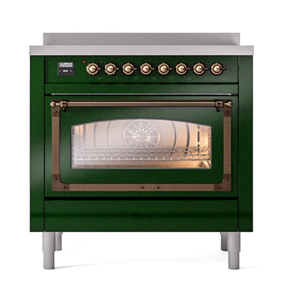 Front view of emerald green induction range with bronze knobs and illuminated oven interior